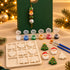 Pormenor do Coffret Natal Encantado com peças para pintar e pendente de Natal